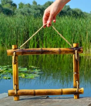 Bamboo frame on the background of the river Stock Photos