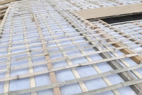 Bamboo lathing for plaster for the walls of frame house Stock Photos