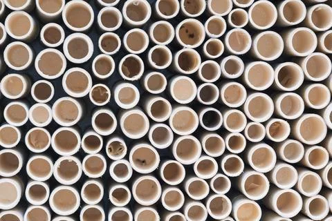 Bamboo pile stacked vertically create texture wall background. Circle in fr.. Stock Photos