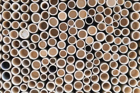 Bamboo pile stacked vertically create texture wall background. Circle in fr.. Stock Photos