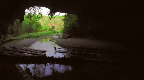 Bamboo rafting out of Tham Loed cave in North Thailand Stock Footage 24261919