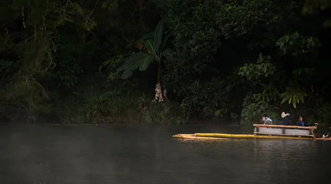 Bamboo rafting through the mist on the lake in morning at Pang-ung, Pine forest Stock Footage 61039953