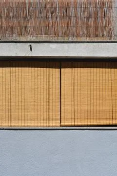 Bamboo roller blinds on a window Stock Photos