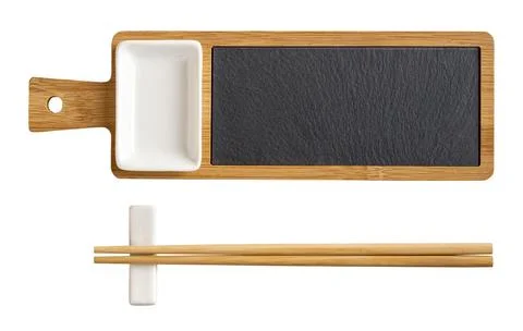 Bamboo sushi serving set cutout. Wooden board with black slate tray. Stock Photos