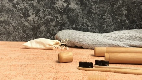 Bamboo toothbrush with natural bristle is demonstrated with space for text Stock Footage 113682383