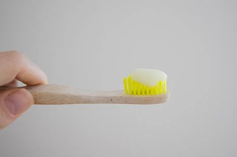 Bamboo toothbrushes close-up on a light background Stock Photos