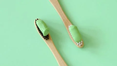 Bamboo Toothbrushes with Toothpaste on Green Screen Video stock 301557915