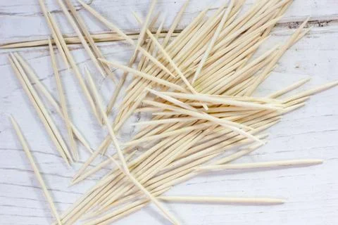 Bamboo toothsticks on the white table. Stock Photos
