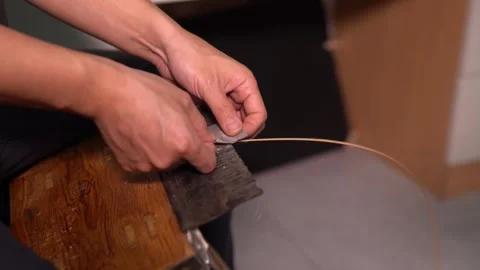 Bamboo weaving artisans perform scraping treatment on bamboo strips Stock Footage 278302219