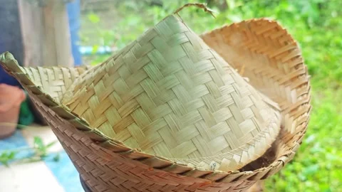 Bamboo weaving cone with steam on dark backdrop. Stock Footage 341871656