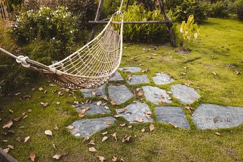 Bamboo Wicker Hammock Hanging On Tree For Relaxing In The Public Garden. Foto stock