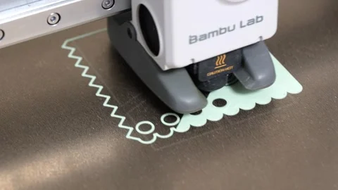 Bambu Lab A1 3D printer hotend laying down the first layer Stock-Footage 344277880