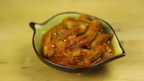 Bamiah, okra, bamia in tomato sauce, onion and olive oil.  Video stock 101154530