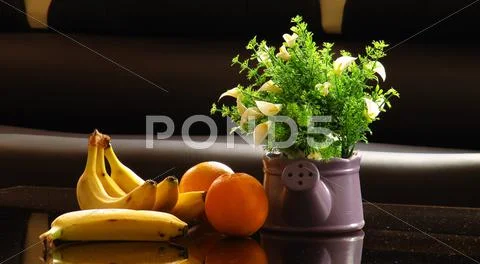 Banana and orange and flower Stock Photos