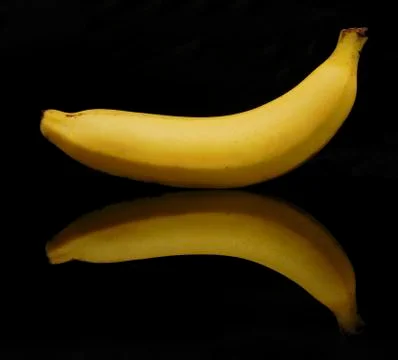 Banana on black background with reflection Stock Photos
