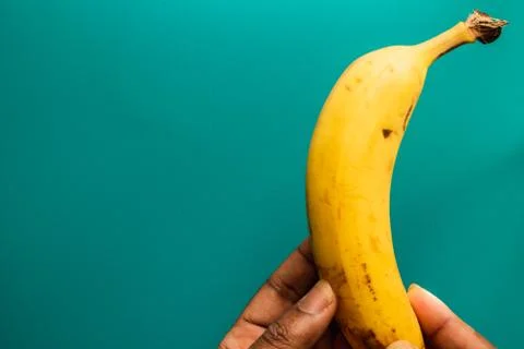 Banana on a blue background Stock Photos