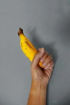 Banana on blue wall II Stock Photos