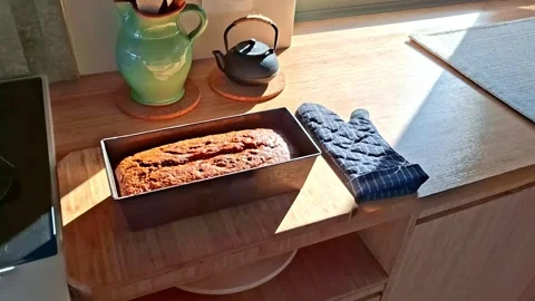 Banana bread in a baking tin Video stock 345186438