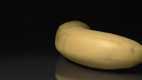 Banana close-up. Fruit on a black background. Stock Footage 144352675