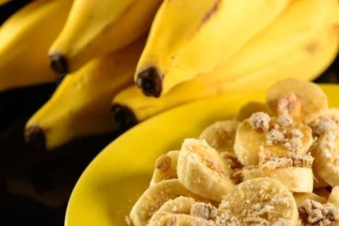 Banana with granola, oats and honey Stock Photos