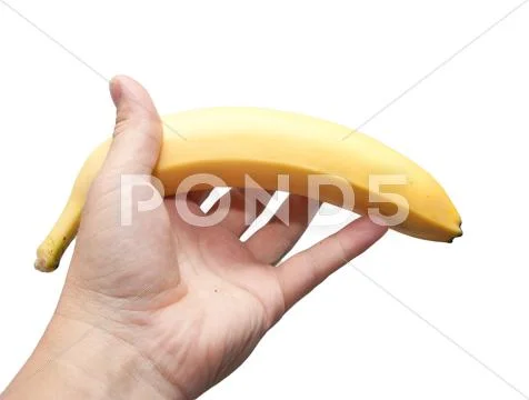 A banana in his hand on a white background Stock Photos