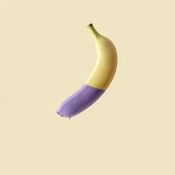 Banana in paint on a yellow background. Stock Photos
