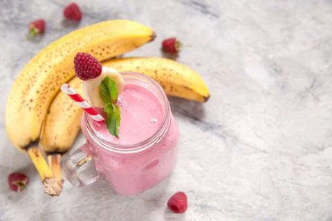 Banana raspberry smoothie Stock Photos