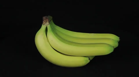 Banana rotates on a black background loop Stock Footage 35740762