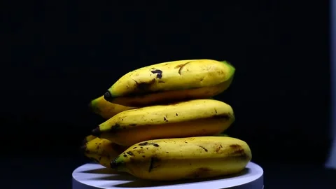 Banana rotating on black background Stock Footage 223192363