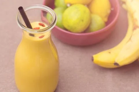Banana smoothie on table Stock Photos