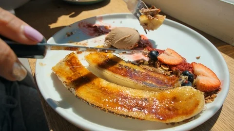 Banana Split creme brulee Ice Cream and Strawberries 4k Video stock 106466733