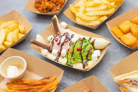 Banana split dessert with assorted toppings Stock Photos
