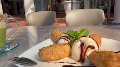 Banana spring roll desserts and avocado dessert. A Vietnam traditional dessert Stock Footage 341852388