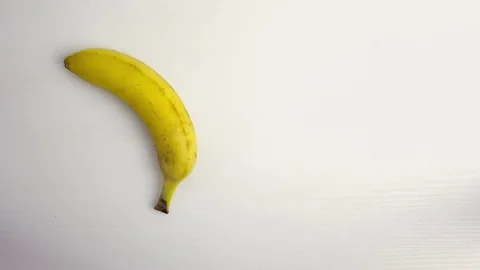 Banana on white table Stock Footage 84983912