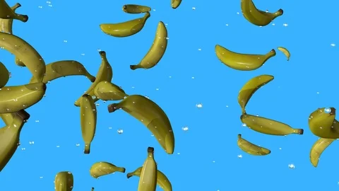 BANANAS AND WATER WILDLY FALLING BLUE BACK GROUND Stock Footage