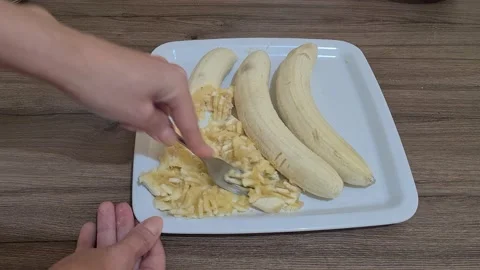 Bananas Are Crushed With Fork Stock Footage 157825630