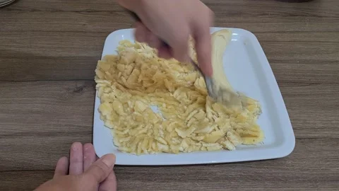Bananas Are Crushed With Fork On The Plate Video stock 157825583
