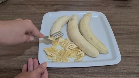 Bananas Are Crushed With Fork On The Plate Stock Footage 157825610