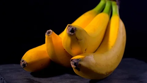 Bananas on a black background Stock Footage 108144608