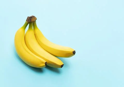 Bananas on a blue background Stock Photos