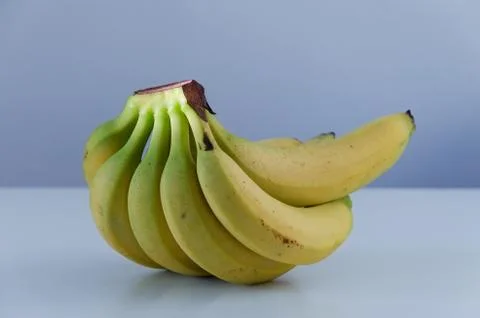 Bananas on bluish background Stock Photos