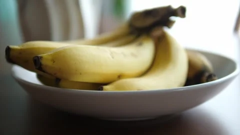 Bananas on Dining Table: Fresh Fruit Display for Healthy Eating Video stock 273555572