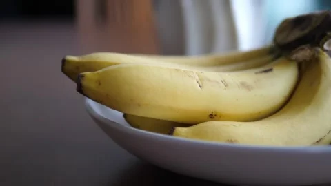 Bananas on Dining Table: Fresh Fruit Display for Healthy Eating Video stock 273555593