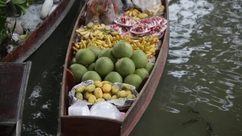 Bananas floating market canoe old woman Stock Footage