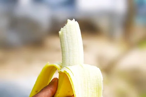 Bananas in the hands of young men Stock Photos