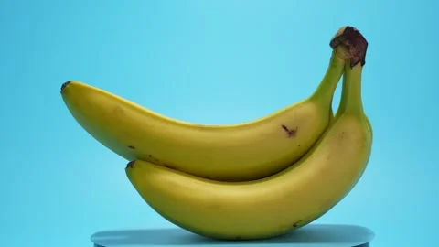 Bananas rotate on a blue background. Stock Footage 280110466
