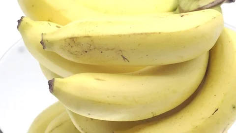 Bananas rotating on white background Stock Footage 124903906