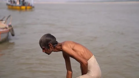 Banaras, Uttar Pradesh - 7 November 2022 - Slow motions shot of an old man .. Stock Footage 223288341