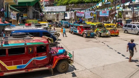 Banaue Timelapse city square with Jeepeneys tricycles cars and transport Stock Footage