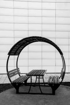 Banches and the table in garden Stock Photos